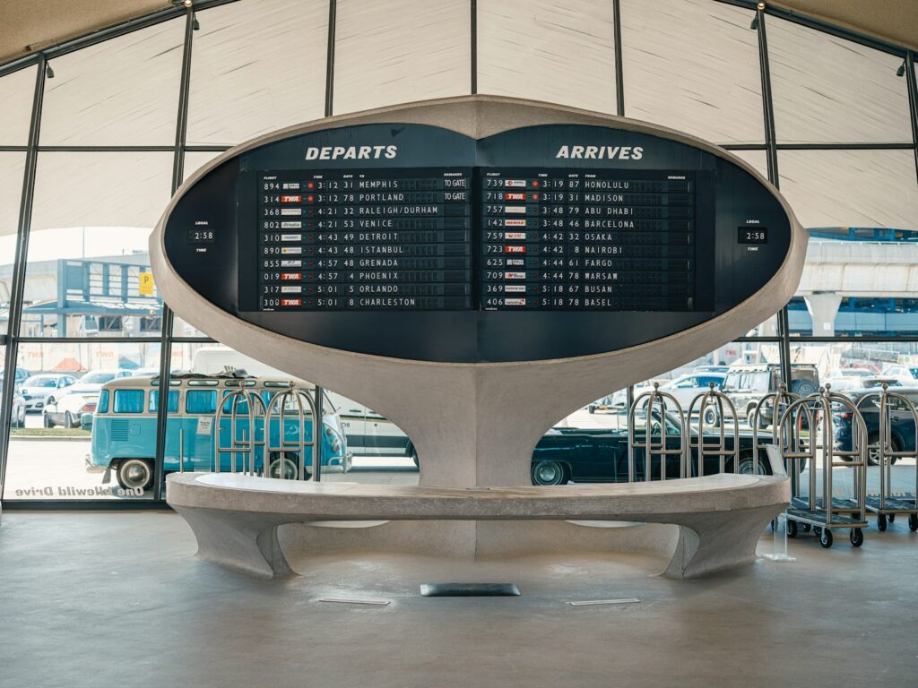 An airport departures and arrivals information board