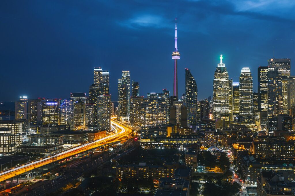 The Toronto skyline and CN Tower lit up at night