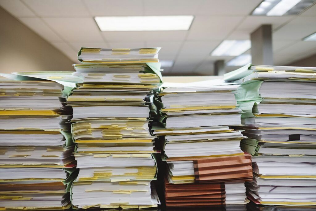 Stacks of paper files and folders in an office